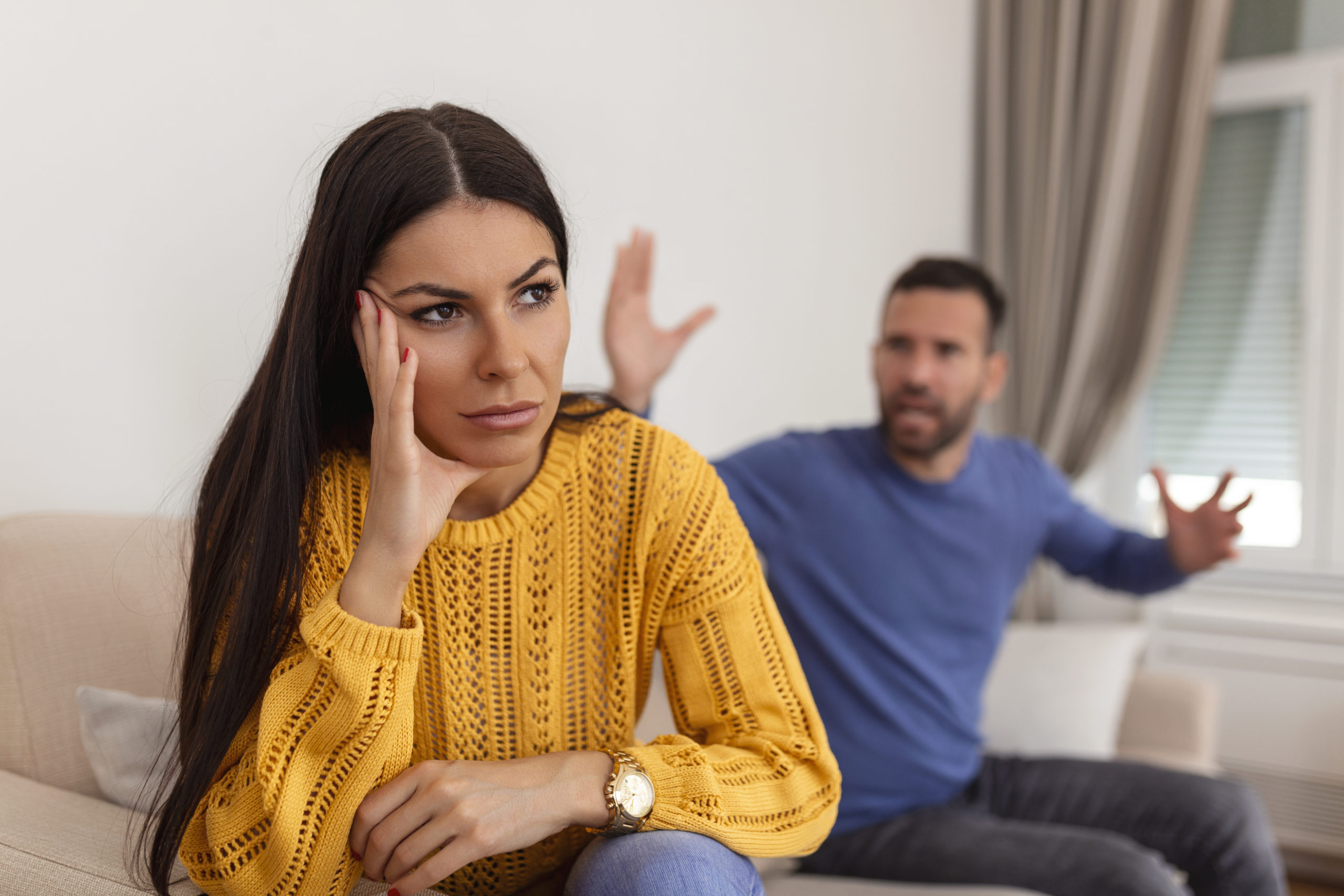 young couple having argument conflict bad relationships angry fury woman angry young couple sit couch living room having family fight quarrel suffer from misunderstanding scaled